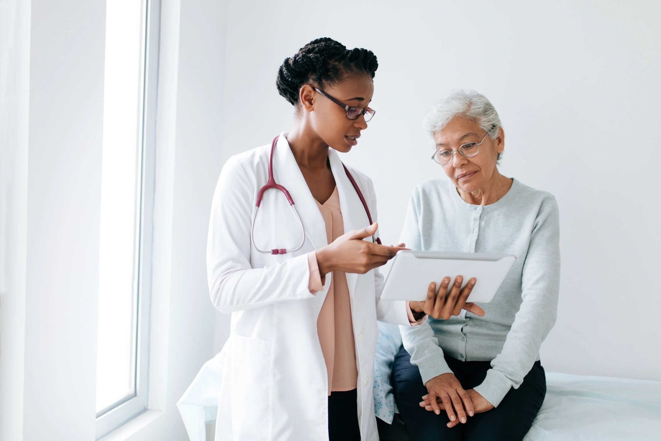 Female doctor consulting with a woman in a medical office